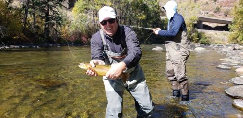 Chad proudly showing off his 4 pound rainbow trout, caught on the Roaring Fork in Aspen, CO.
