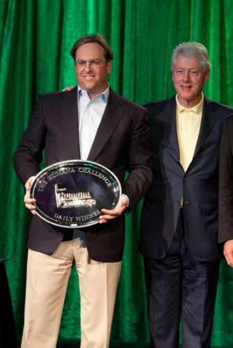 Chad Brownstein is presented an award by President Bill Clinton